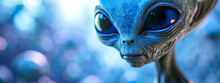 Alien Creature With Large Eyes And Blue Skin Against A Bokeh Light Background.