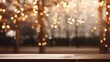 Empty wood tabletop with fairy lights hanging on tree in night garden, bokeh light background