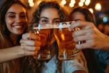 Fototapeta Uliczki - young people toasting beer in a group of friends