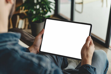 cropped view of man holding digital tablet with blank screen at home