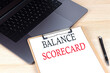 © Iryna - BALANCED SCORECARD text written on a paper clipboard on laptop
