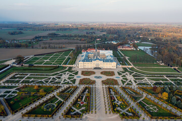 Wall Mural - Aerial view on baroque garden of Rundale palace in autumn time. Symmetrical park in vibrant colors