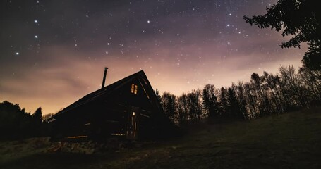 Wall Mural - romantic night sky with milky way stars over old wooden hut in forest nature astronomy time lapse