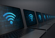 Laptop devices lined up diagonally with Wi-Fi internet icon on their screens on a dark background. Realistic rendering.