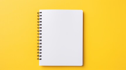 Vibrant yellow background with open notebook - copy space for text, minimalistic office or school concept