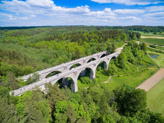 Wall Mural - Aerial view of old concrete railway bridges in Stanczyki, Mazury, Poland