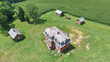 Aerial View of Abandoned Rural Mansion with Lush Surroundings