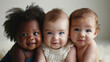 Charming diverse little children against white backdrop, gazes confidently into the camera, smiles. Childhood innocence and diversity, happy children