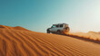 © Alina Zavhorodnii - wide-angle shot, white SUV driving on a dune, daytime