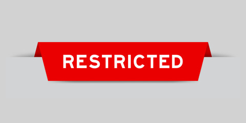 Sticker - Red color inserted label with word restricted on gray background