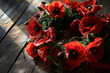 Wreath made of red poppies, suitable for memorial ceremonies or as a visual tribute to fallen heroes.