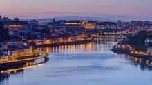 Aerial View Before Sunrise At The Most Emblematic Area Of Douro River Timelapse Night To Day Transition. World Famous Porto Wine Production Area.