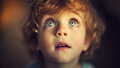 Candid shot of a child's innocent and curious expression, capturing the wonder and joy in their eyes, remarkable faces, child portrait, hd, candid with copy space