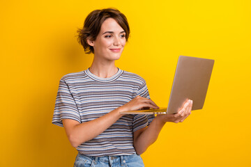 Aufkleber - Photo of smart positive pretty woman with bob hairdo dressed striped t-shirt look at laptop chatting isolated on yellow color background