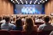 © PeopleWorker - People in audience at the conference hall blurred background