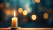Burning candle on blurred bokeh background with space for text