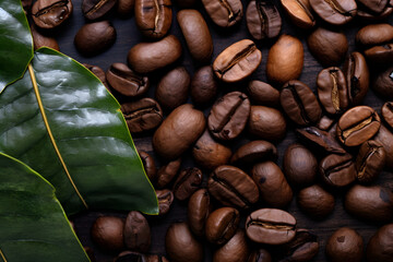 Wall Mural - coffee beans in background with leaf