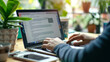 © DLC Studio - candidate thoughtfully typing a thank-you email on their laptop or tablet, possibly with a draft of the email visible on the screen