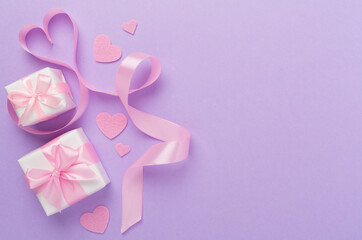 Wall Mural - Valentines day composition with gifts on color background, top view.