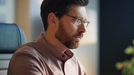 Wall Mural - bearded businessman typing laptop in office closeup. focused manager working