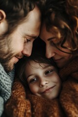 Poster - A heartwarming image of a man and a woman lovingly cuddling with a child. Perfect for family-related themes and advertisements