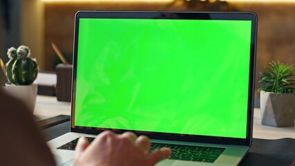 Wall Mural - unrecognizable person using mockup laptop working remotely at home close up.