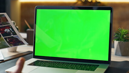 Wall Mural - manager discussing work greenscreen laptop video conference in office close up.