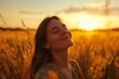 © Adriana - Backlit Portrait of calm happy smiling free woman with closed eyes enjoys a beautiful moment life on the fields at sunset