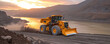 Bulldozer machine on a dirt terrain at sunset
