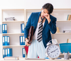 Wall Mural - Employee coming to work straight from bed