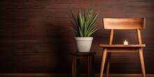 Wooden Chair Near Desk With Aloe Plants And Candles.
