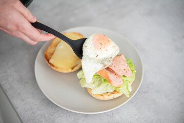 Delicious healthy sandwich for a snack breakfast in men's hands. Toast bread tomato ham leaf salad