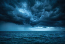Storm Clouds Over The Sea Are Black And Blue. A Hurricane Is Coming A Downpour. Natural Sinister Background. Storm Warning. Weather Disasters. The Sea Is A Gloomy Landscape. Blue Abstract Background