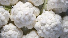  A Close Up Of Cauliflower Florets With Drops Of Water On The Top Of The Florets.