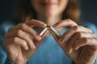 © Gilang - Close up view of a girl breaking a cigarette in front camera generative ai