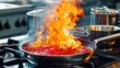 Flames engulfing a pan with tomato sauce on a stove