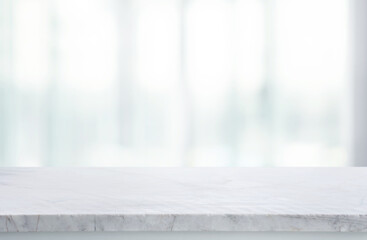 Canvas Print - Selective focus.Marble table top on blur abstract window glass background.