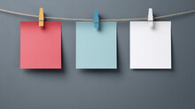 Four Colorful Paper Blank Notes Hanging On The Rope With Wooden Clothespins