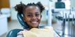 African American elementary school girl sitting in dentist chair exposing white teeth. Creative banner with happy child kid for pediatric dentistry. Children treatment teeth, medical checkup concept