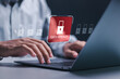© Pakin - Data breach and hacker attack concept. Person use laptop with virtual red padlock icon for information leak. data protection, firewalls, privacy measures, and access information.