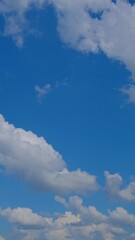 Wall Mural - blue sky with fluffy cloud time lapse on a sunny day 4k footage.