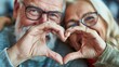 Close up portrait of senior couple making heart shape with their hands.AI.