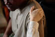 © AnnaStills - Closeup of hand of caring caucasian woman on shoulder of african american man, sign of moral support