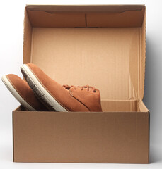 New men's suede shoes in box on white background