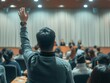 Man Raising Hands Leading Classroom Discussion With Engaged Audience