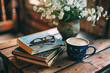 Book accompanied by reading accessories like glasses, bookmarks, or a cup of coffee
