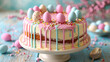 Pastel Easter sponge cake with dripping icing and candy eggs. Springtime baking and dessert concept for poster and recipe design
