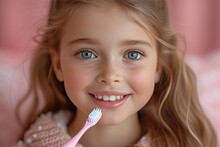 Happy Smiling Child Kid Girl Brushing Teeth With Toothbrush On Pink Background. Health Care, Dental Hygiene. Mockup, Copy Space