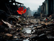 Beautiful red wild flower growing in the ruins of a city