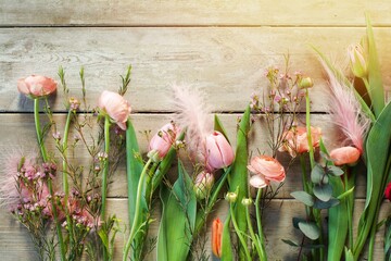 Wall Mural -  spring flowers on wooden background - floral season decoration for easter, mothers day, birthday - spring greeting card